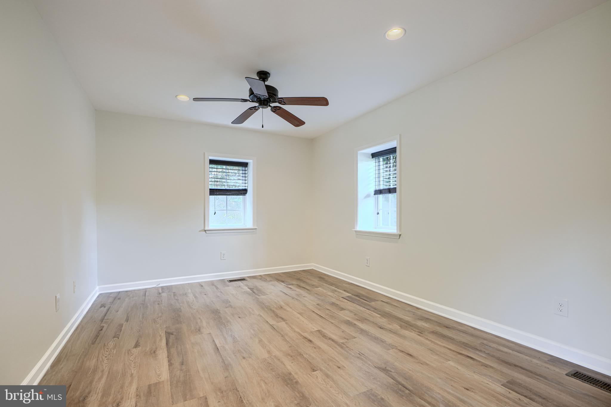 605 Paradise Road Aberdeen, MD 21001 - Photo 15 of 47 a view of empty room with wooden floor and fan