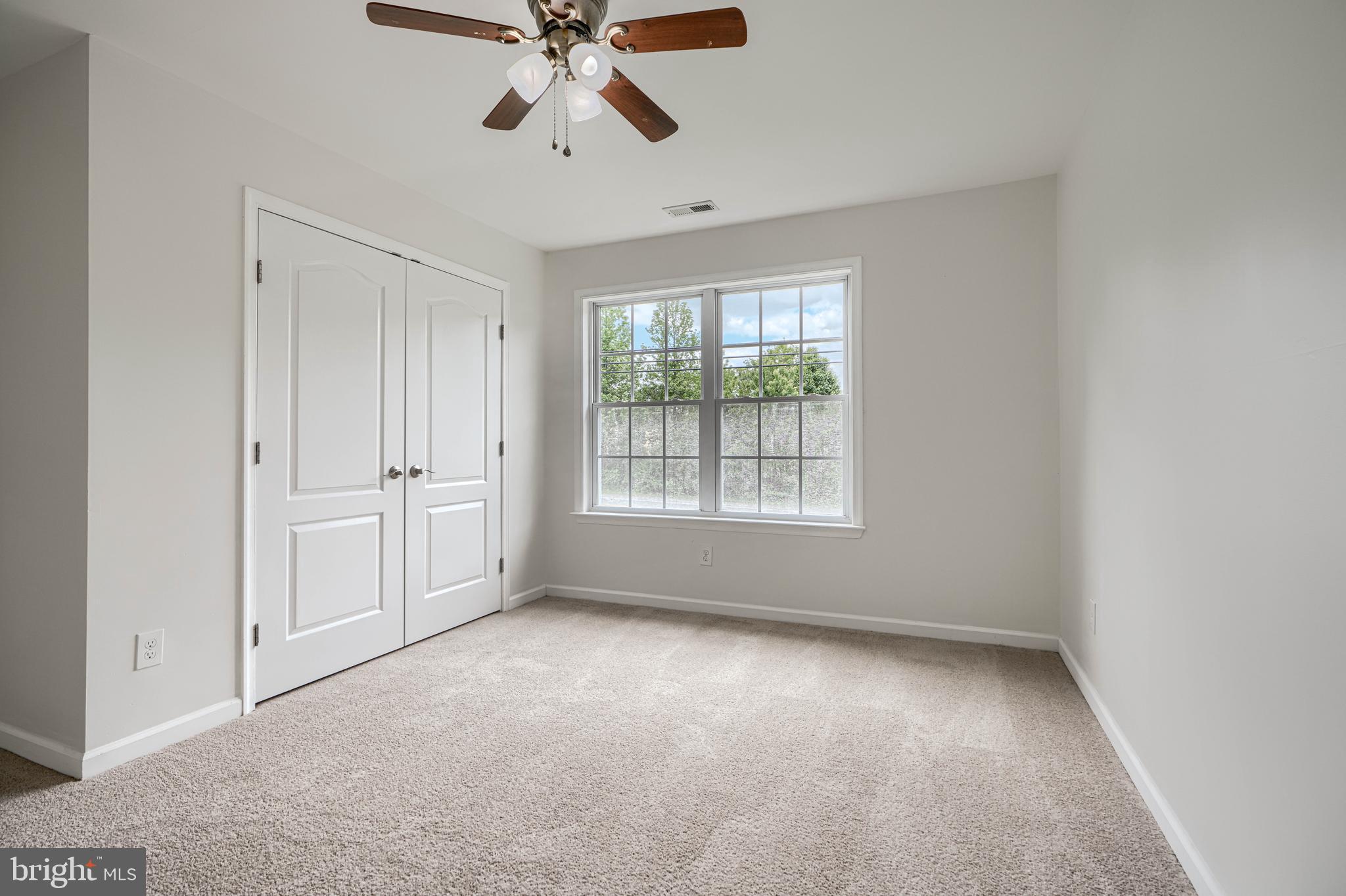 605 Paradise Road Aberdeen, MD 21001 - Photo 25 of 47 an empty room with windows and fan