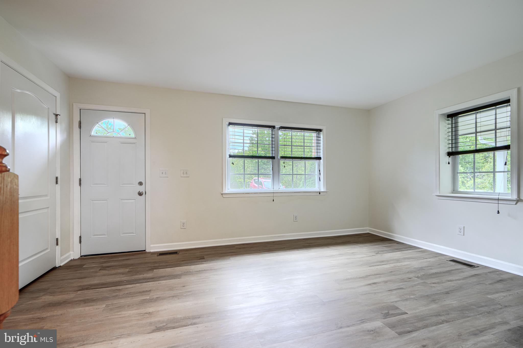 605 Paradise Road Aberdeen, MD 21001 - Photo 4 of 47 an empty room with wooden floor and windows