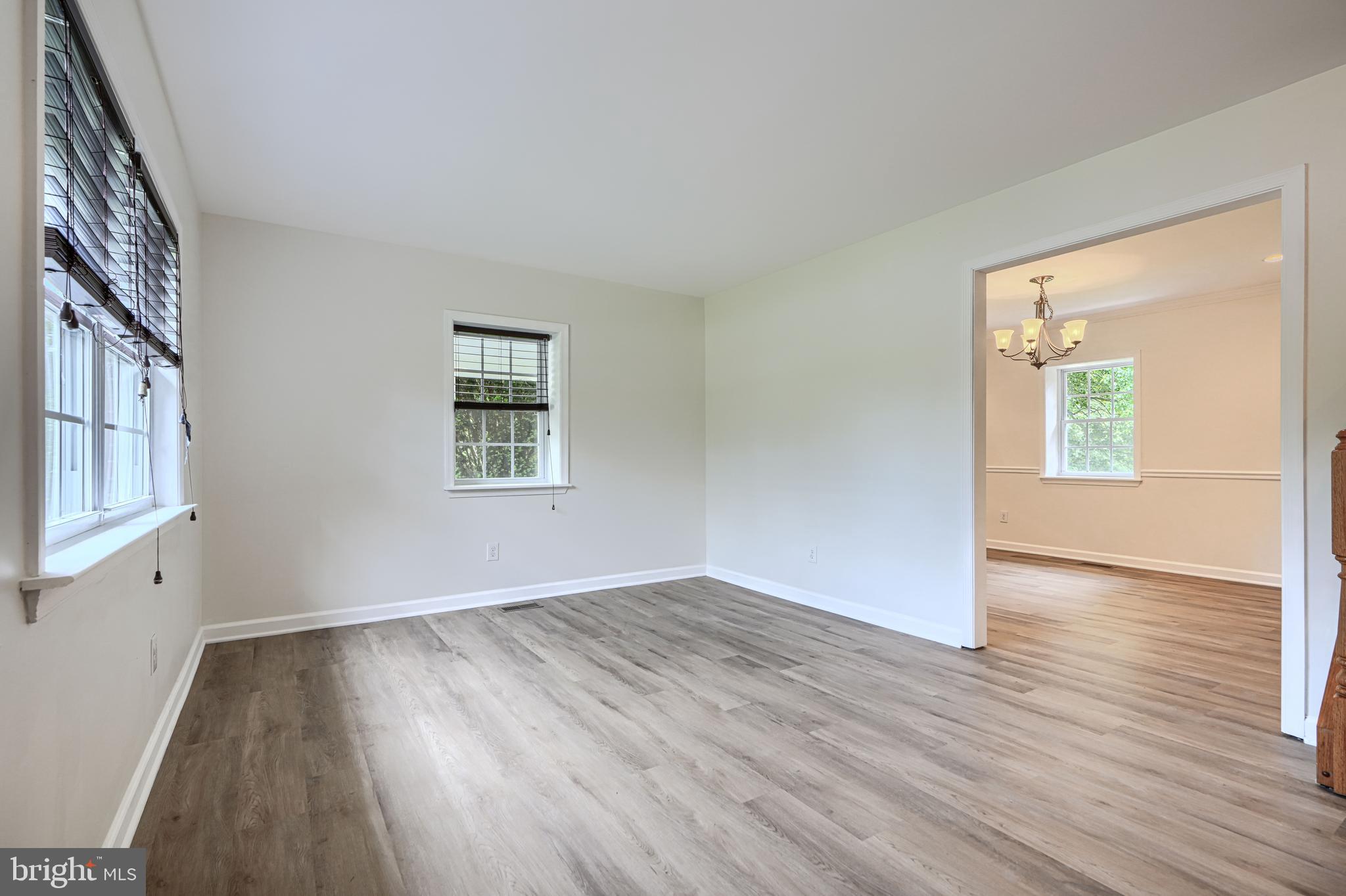 605 Paradise Road Aberdeen, MD 21001 - Photo 7 of 47 an empty room with wooden floor and windows