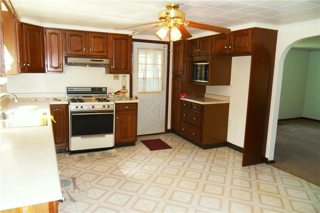 3722 North Balsiger Road Vandergrift, PA 15690 - Photo 10 of 18 a kitchen with stainless steel appliances granite countertop a stove a refrigerator and a cabinets