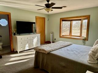 1818 Burnt Chimney Road Wirtz, VA 24184 - Photo 21 of 38 a bedroom with a bed and a flat screen tv