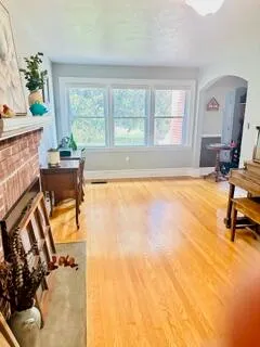 a view of a dining room with furniture and window