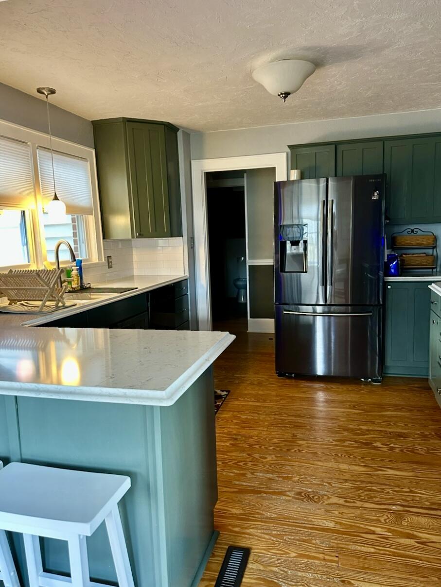 1818 Burnt Chimney Road Wirtz, VA 24184 - Photo 6 of 38 a kitchen with kitchen island a sink stove and refrigerator
