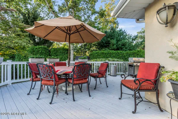 a view of walk in closet with clothes
