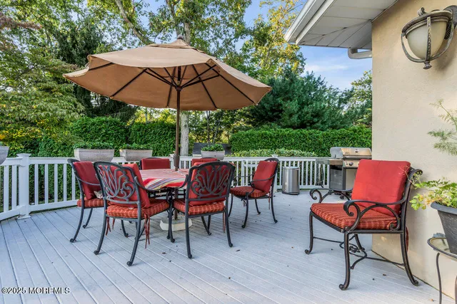 a view of walk in closet with clothes