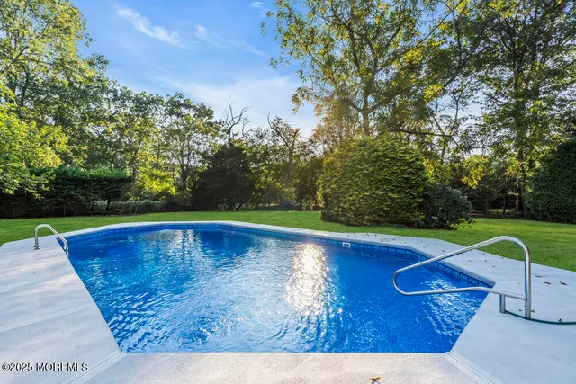 a bathroom with a granite countertop sink mirror and double