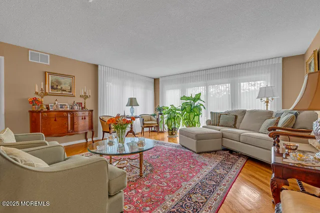 a bedroom with a bed and wall painting