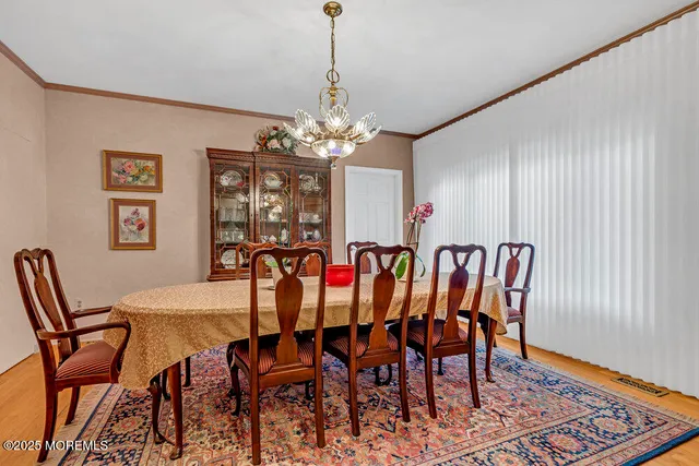 a view of a livingroom with furniture and a flat screen tv