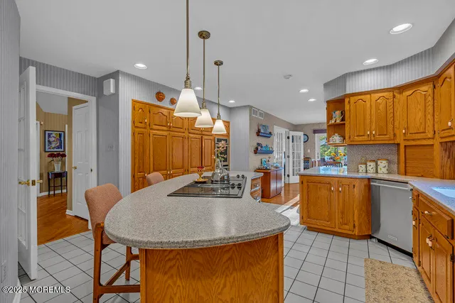 a view of a house with a yard and potted plants