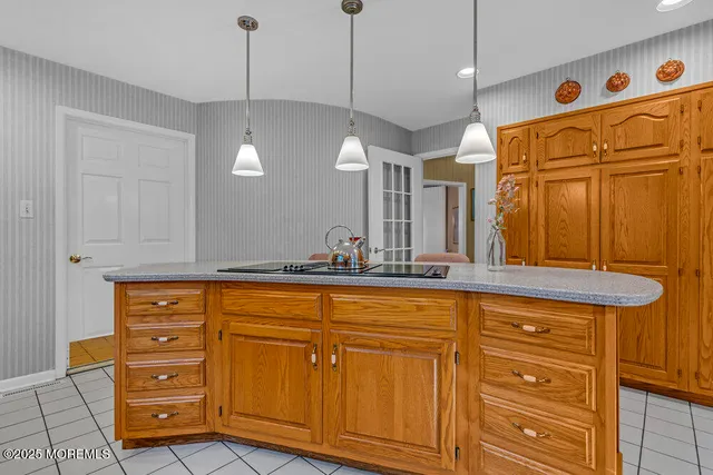 an aerial view of residential house with outdoor space and swimming pool