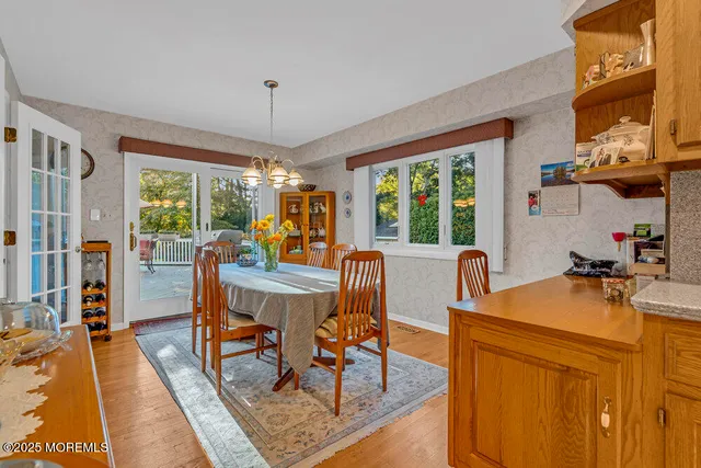 an aerial view of a house with a yard swimming pool outdoor seating