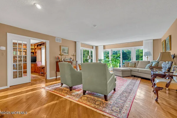a front view of a house with a garden and patio