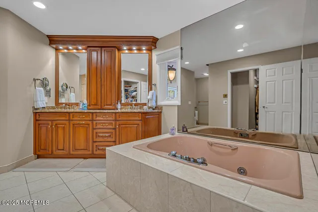 an aerial view of a house with a yard basket ball court and outdoor seating