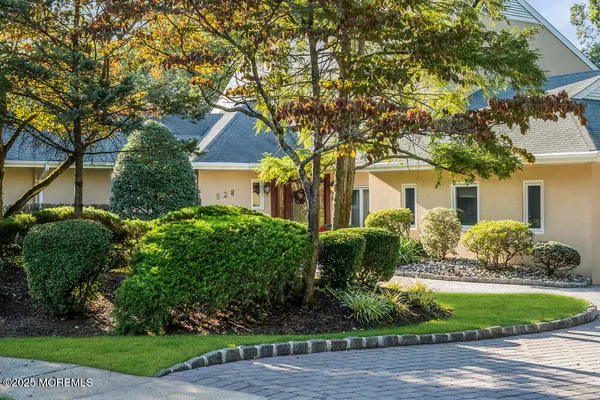 a view of a chairs and table in the patio