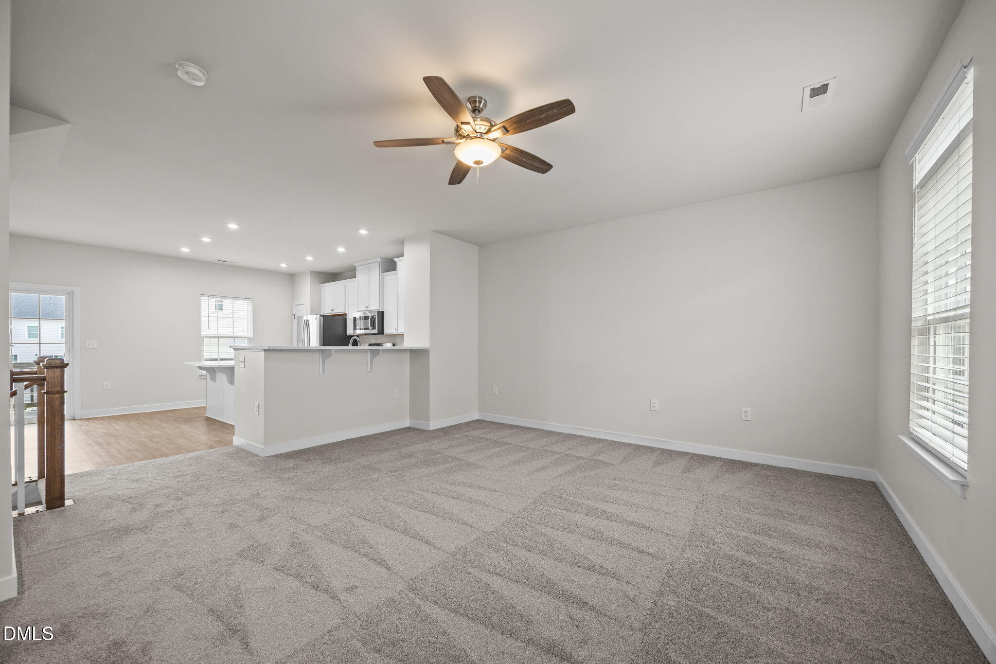 945 Anthem Lane Durham, NC 27713 - Photo 13 of 51 a view of a livingroom with a ceiling fan and window