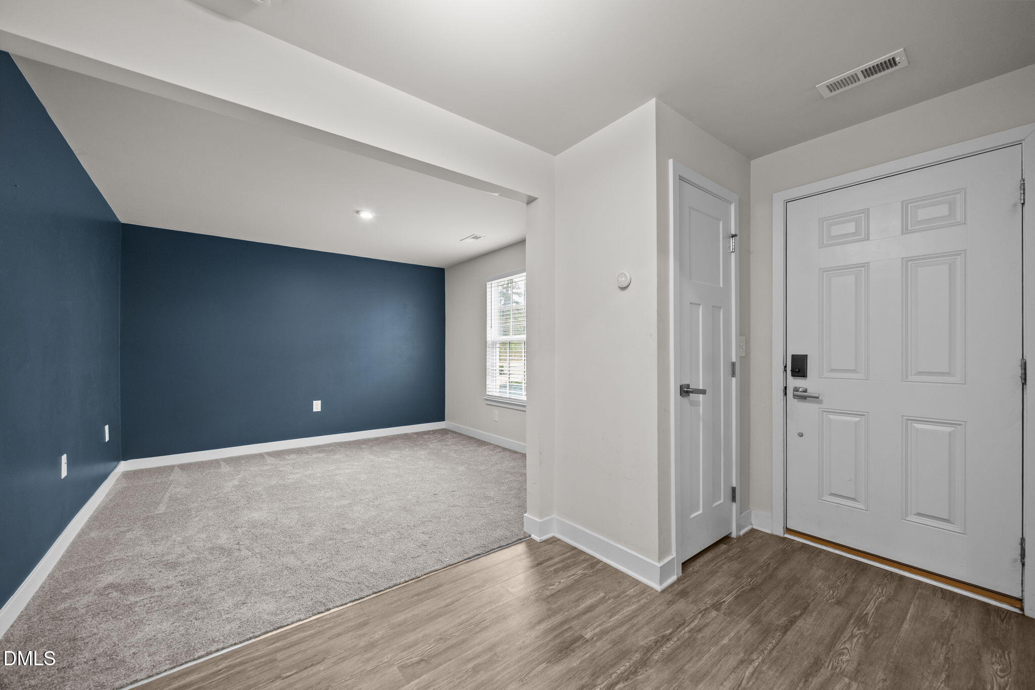 945 Anthem Lane Durham, NC 27713 - Photo 16 of 51 a view of an empty room with wooden floor