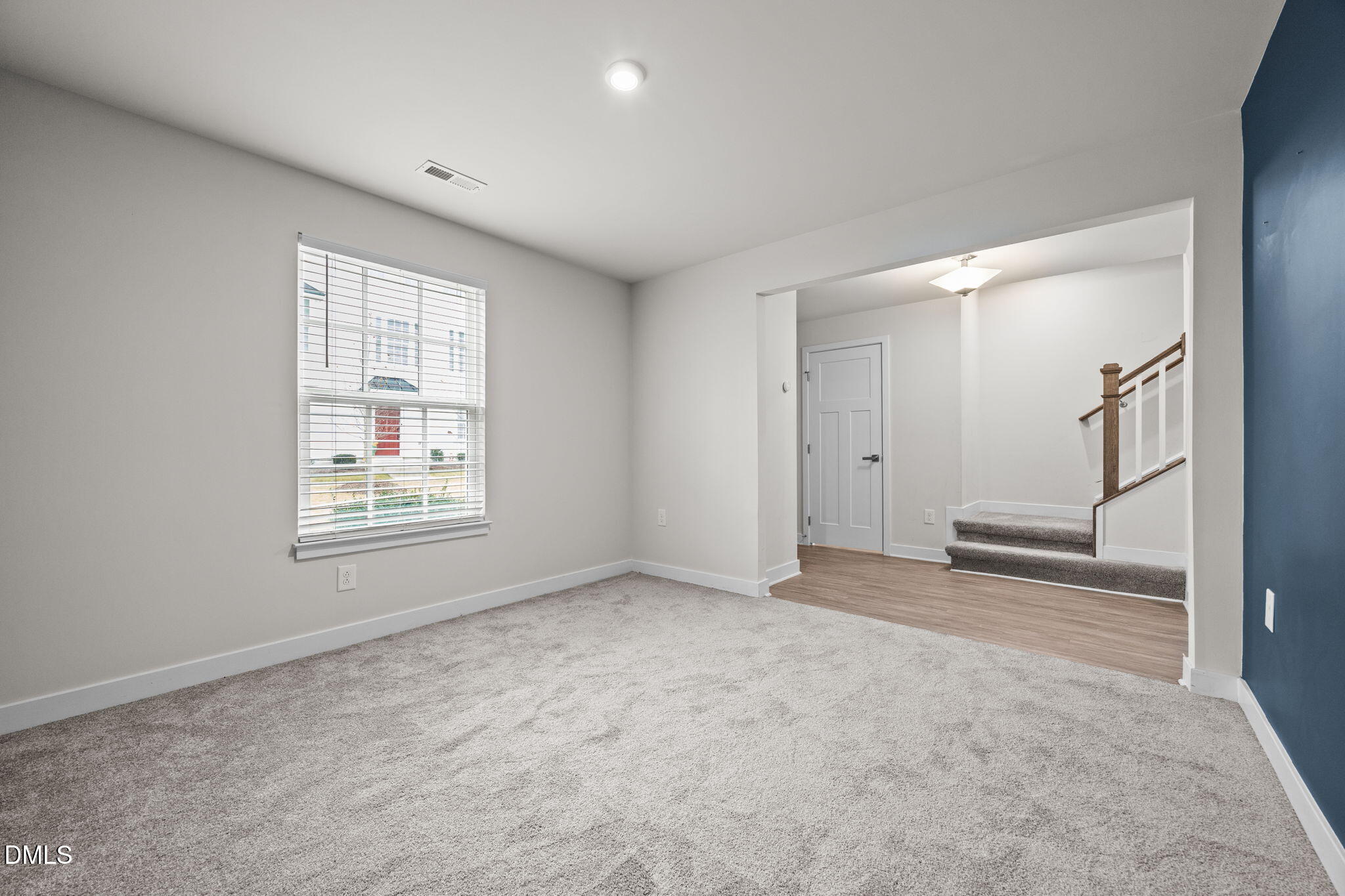 945 Anthem Lane Durham, NC 27713 - Photo 17 of 51 an empty room with windows and pillars in it