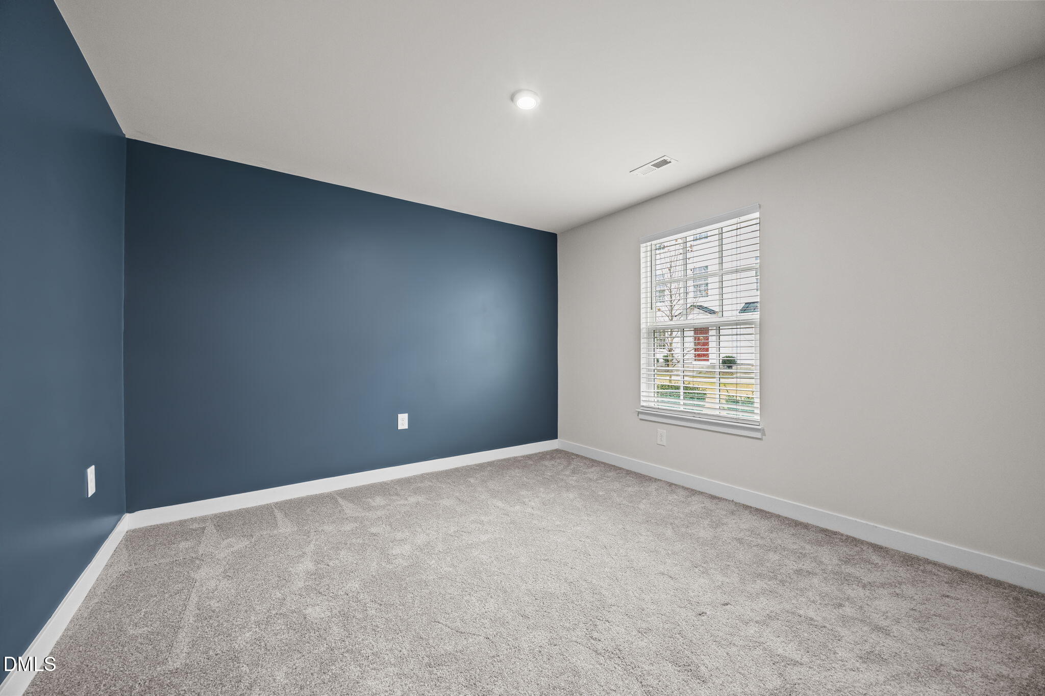 945 Anthem Lane Durham, NC 27713 - Photo 18 of 51 an empty room with windows