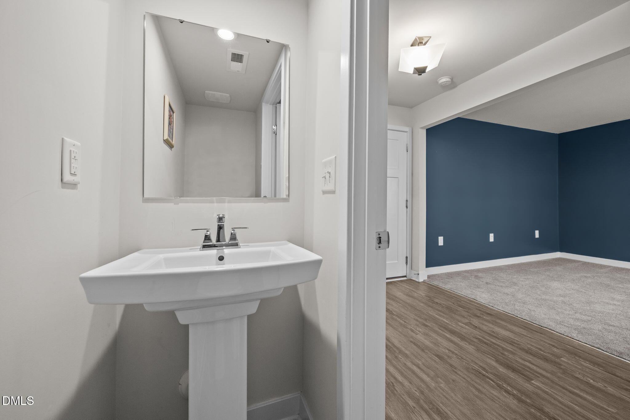 945 Anthem Lane Durham, NC 27713 - Photo 19 of 51 a bathroom with a sink and a mirror