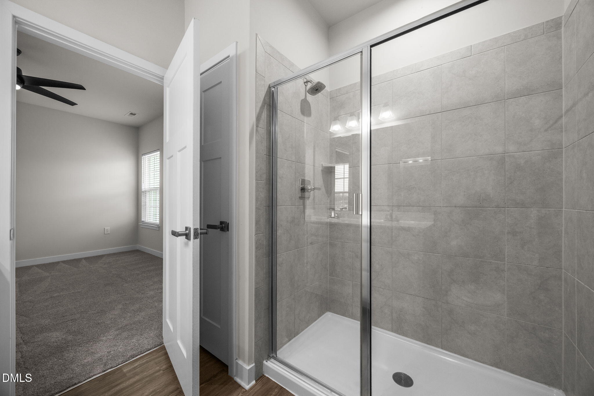 945 Anthem Lane Durham, NC 27713 - Photo 24 of 51 a bathroom with a glass shower door