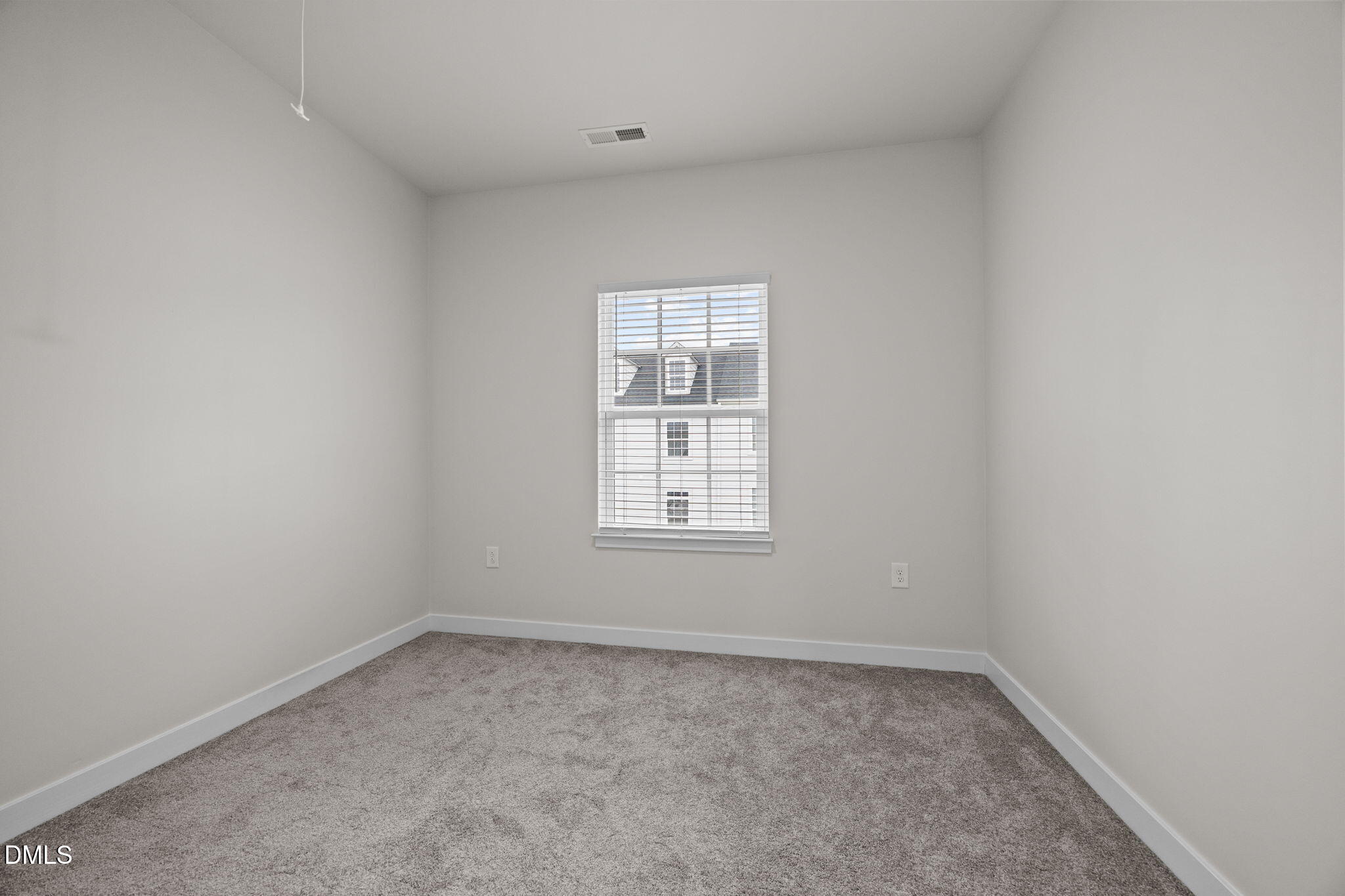 945 Anthem Lane Durham, NC 27713 - Photo 25 of 51 an empty room with a window