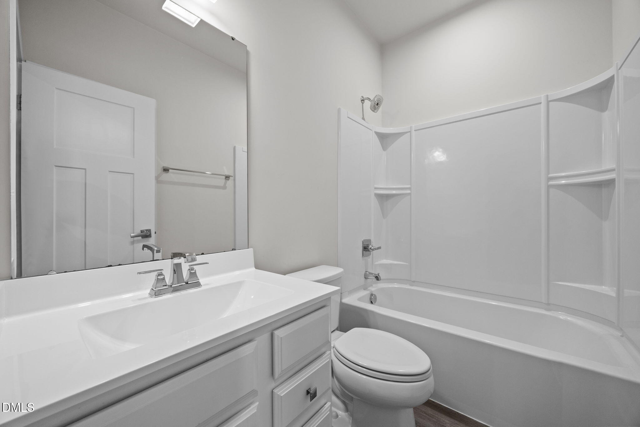 945 Anthem Lane Durham, NC 27713 - Photo 28 of 51 a bathroom with a sink a toilet and a mirror
