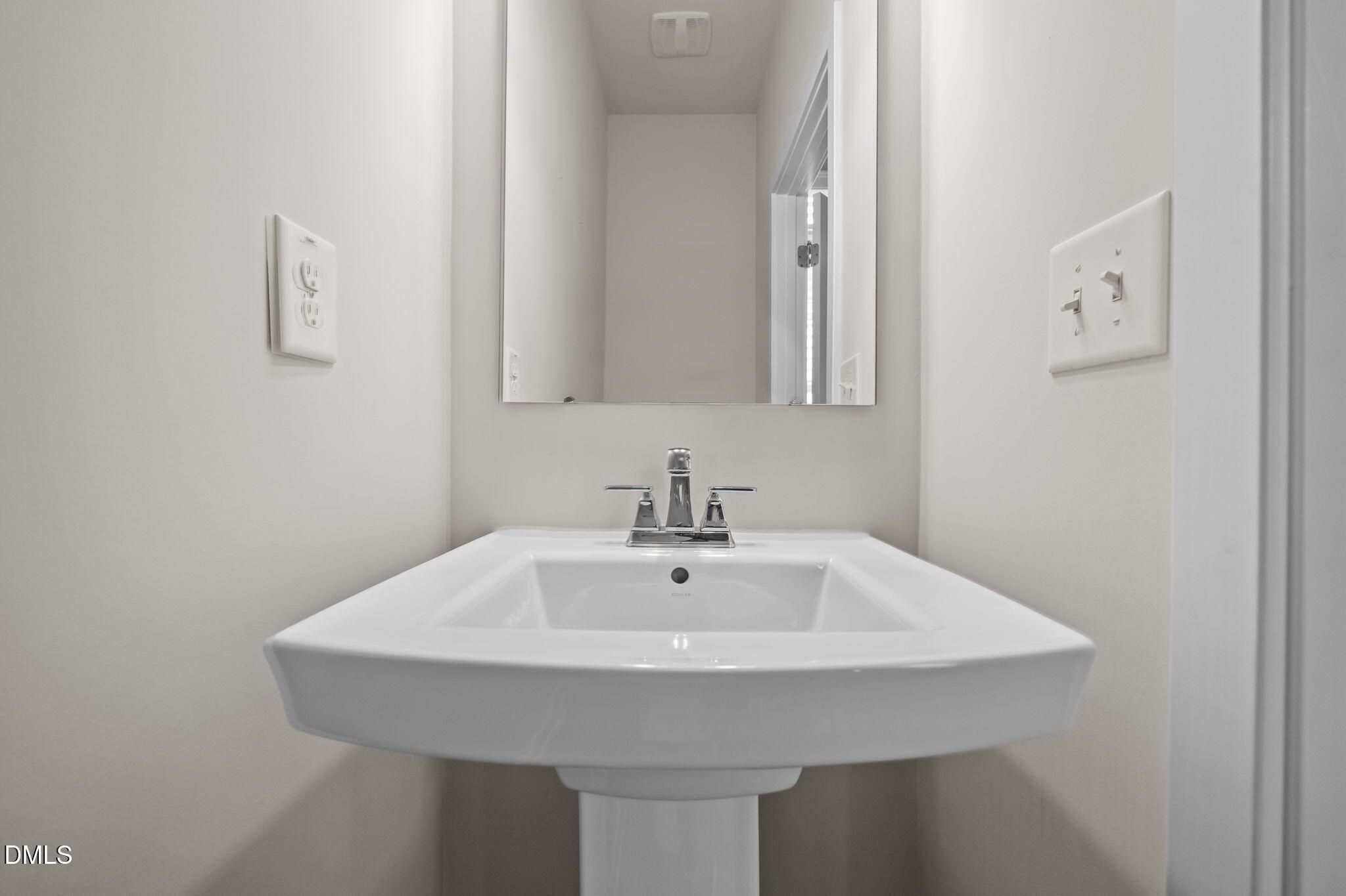 945 Anthem Lane Durham, NC 27713 - Photo 30 of 51 a bathroom with a sink and a mirror