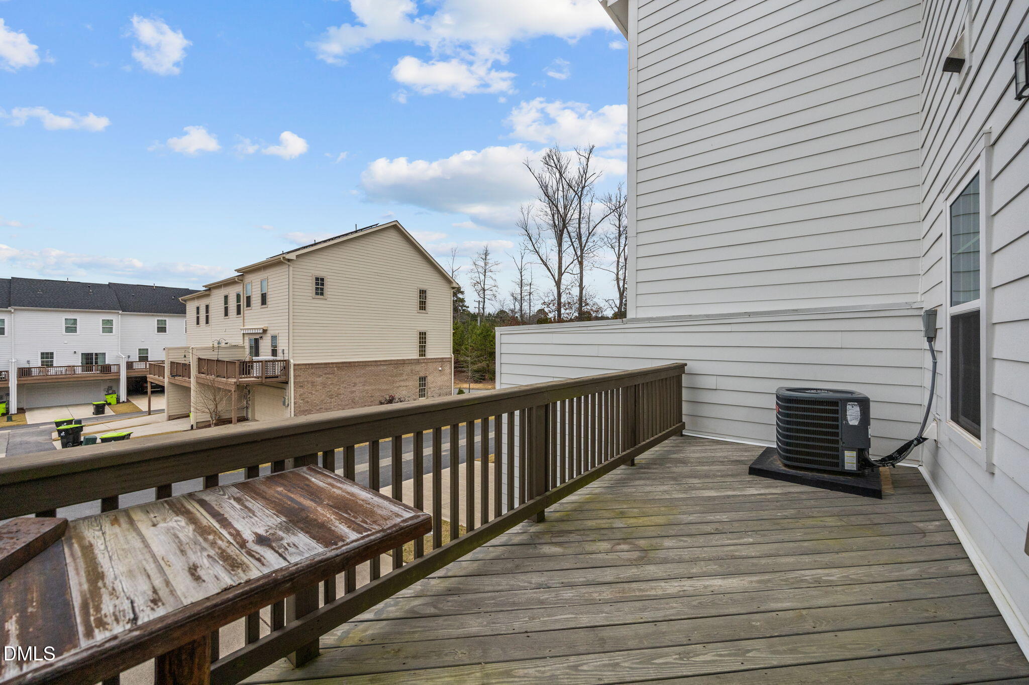 945 Anthem Lane Durham, NC 27713 - Photo 32 of 51 a view of a balcony with wooden floor and furniture