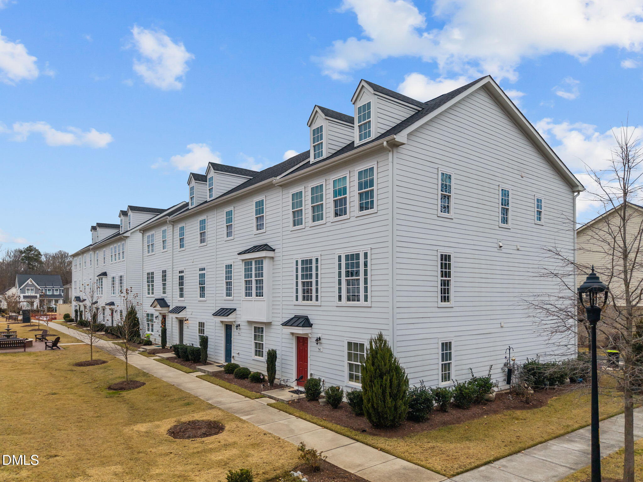 945 Anthem Lane Durham, NC 27713 - Photo 38 of 51 a view of a white building among the street with palm trees