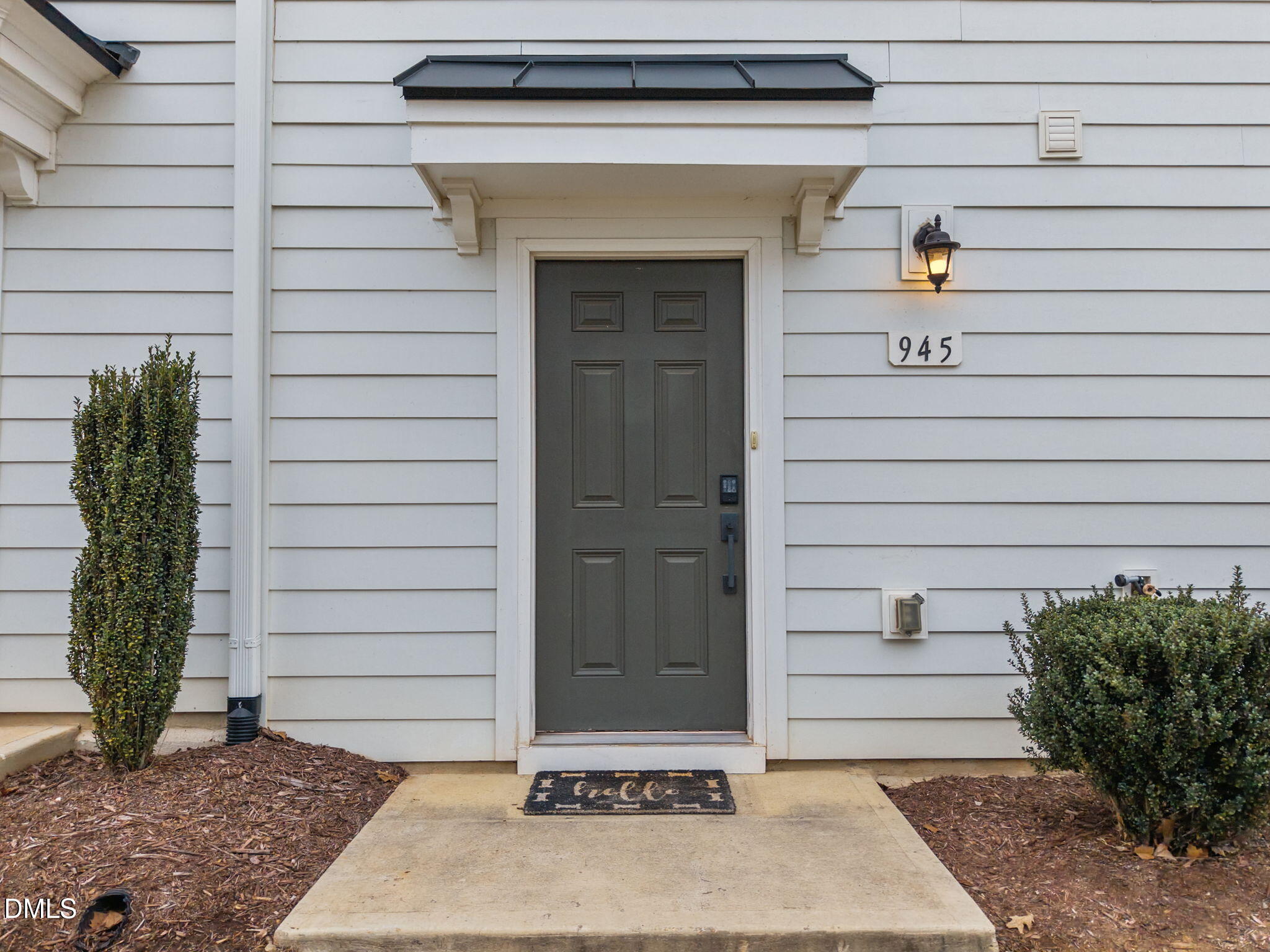 945 Anthem Lane Durham, NC 27713 - Photo 40 of 51 a front view of a house with a garden
