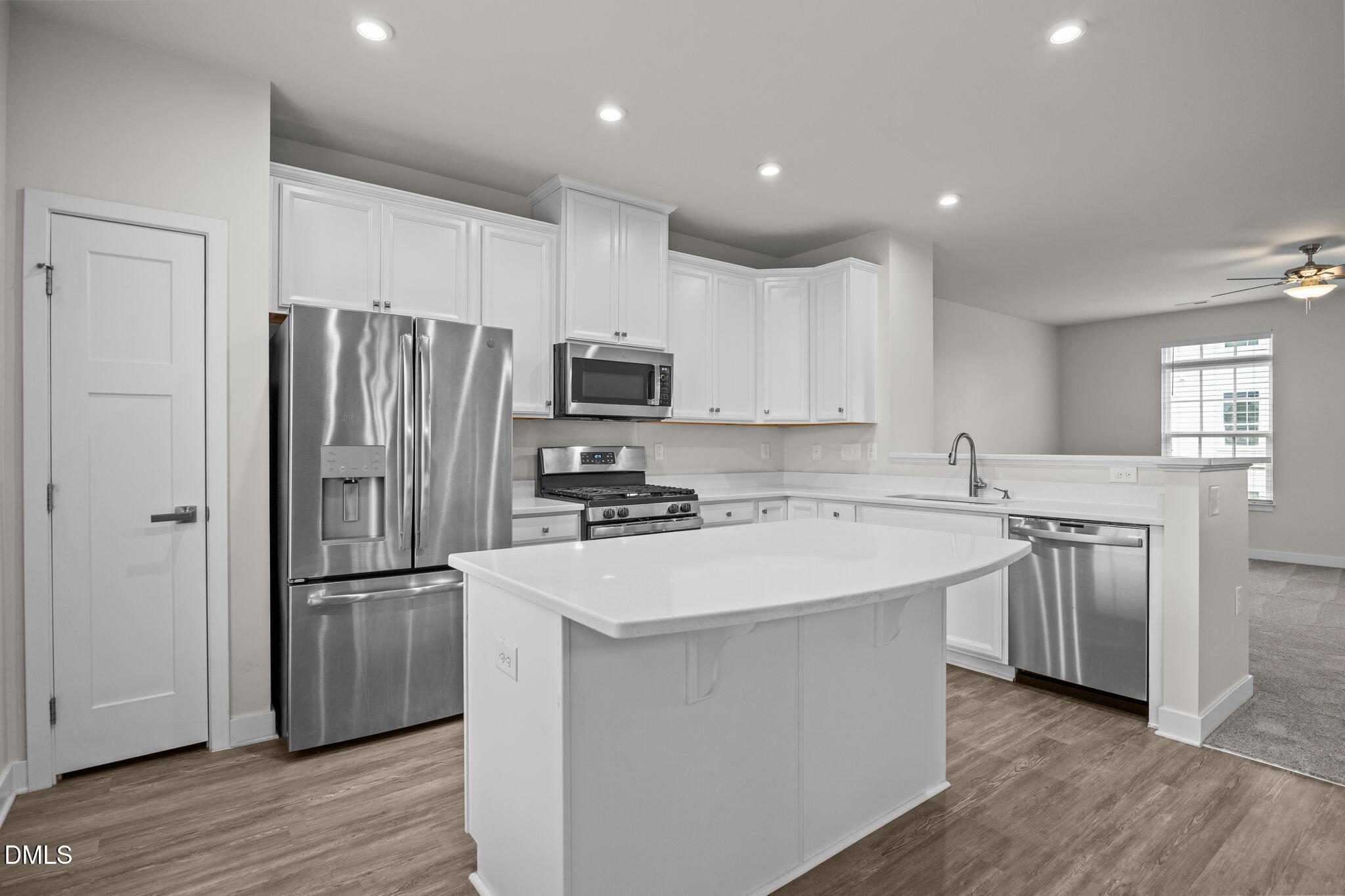 945 Anthem Lane Durham, NC 27713 - Photo 4 of 51 a kitchen with stainless steel appliances granite countertop a refrigerator stove and sink