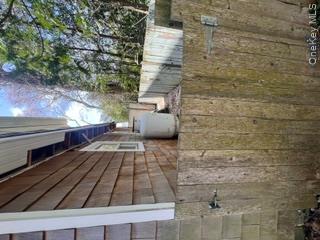 106 Lewis Road East Quogue, NY 11942 - Photo 11 of 12 a picture of a door of the house