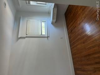 106 Lewis Road East Quogue, NY 11942 - Photo 9 of 12 a room with a window