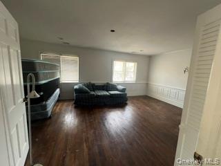 106 Lewis Road East Quogue, NY 11942 - Photo 10 of 12 a living room with furniture and a wooden floor