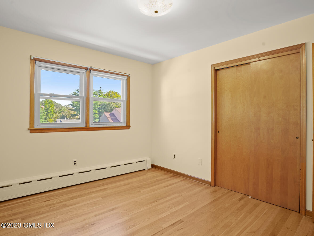 63 Cos Cob Avenue, Unit B Cos Cob, CT 06807 - Photo 9 of 14 an empty room with a window