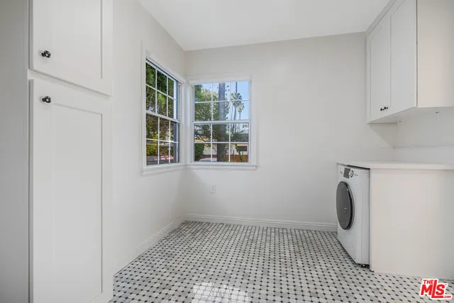 a bathroom with a glass door shower