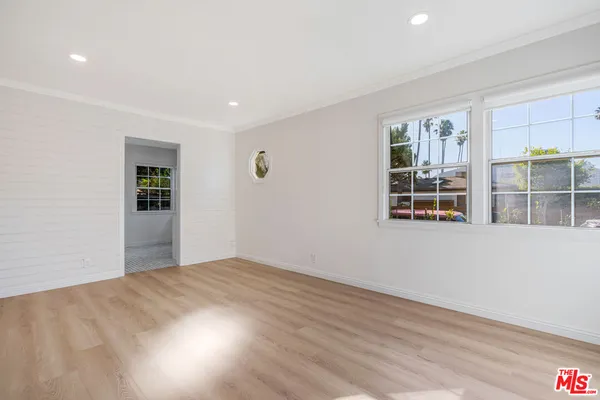 a view of empty room with windows