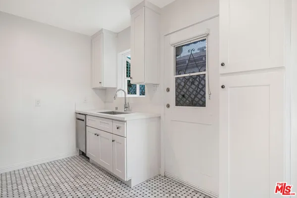 a bathroom with a sink a vanity and a mirror