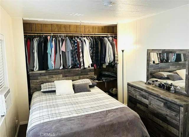 a bedroom with a bed and a walk in closet