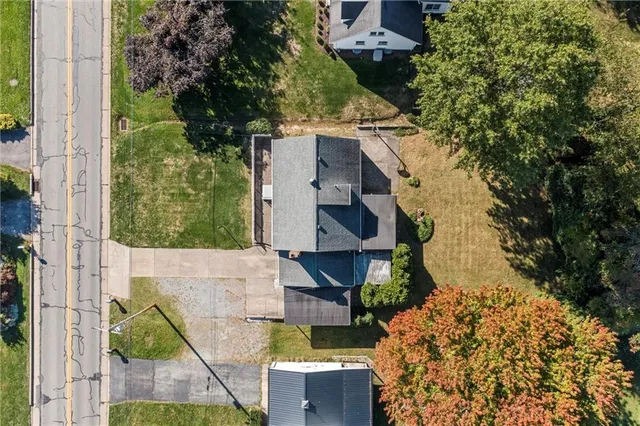 an aerial view of residential house with outdoor space