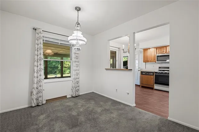 a view of a kitchen with a sink and dishwasher cabinets
