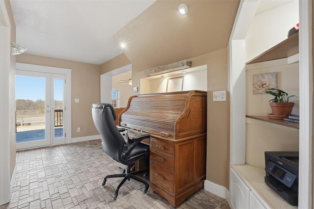 5824 Sky Road Joshua, TX 76058 - Photo 11 of 40 a view of a workspace with furniture and a window