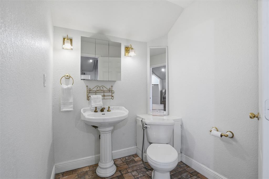 5824 Sky Road Joshua, TX 76058 - Photo 20 of 40 a bathroom with a sink toilet and a mirror