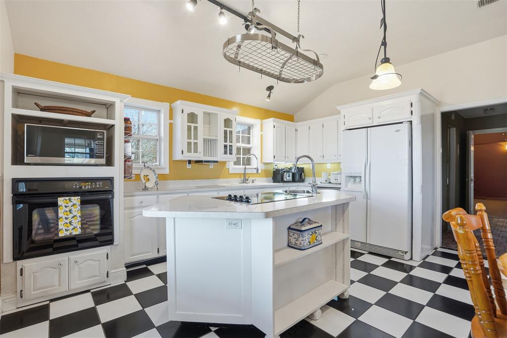 5824 Sky Road Joshua, TX 76058 - Photo 28 of 40 a kitchen with a stove a sink and a refrigerator