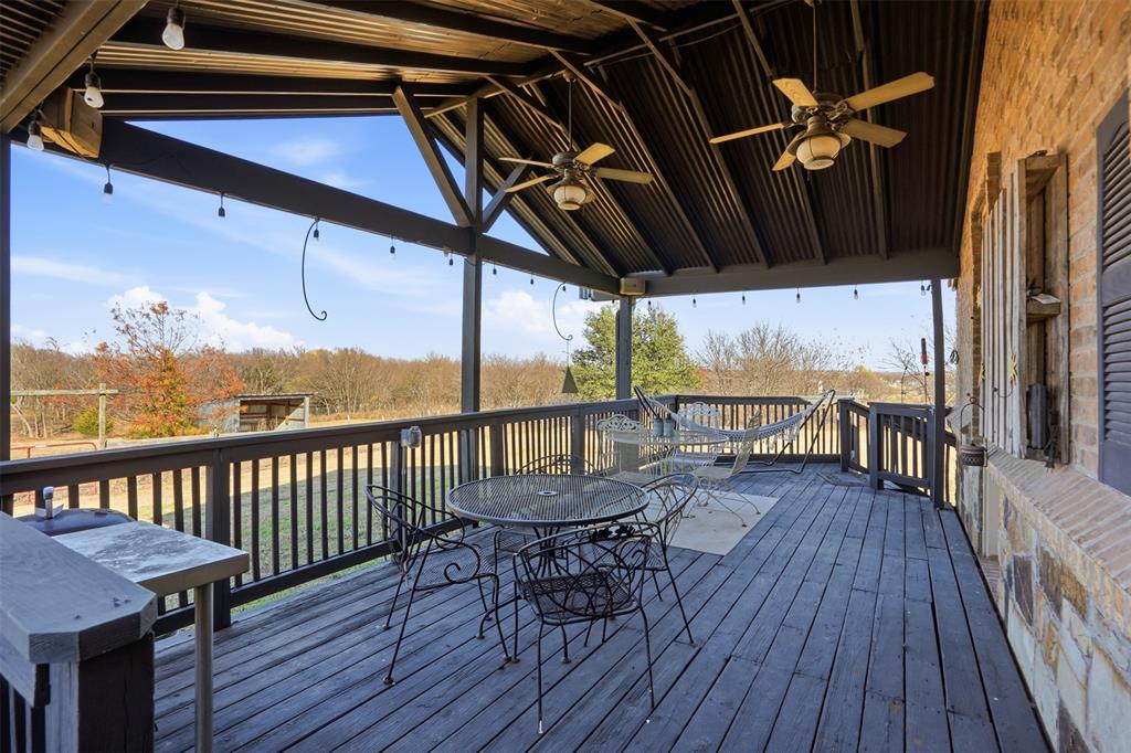 5824 Sky Road Joshua, TX 76058 - Photo 32 of 40 a view of a balcony with furniture and wooden floor