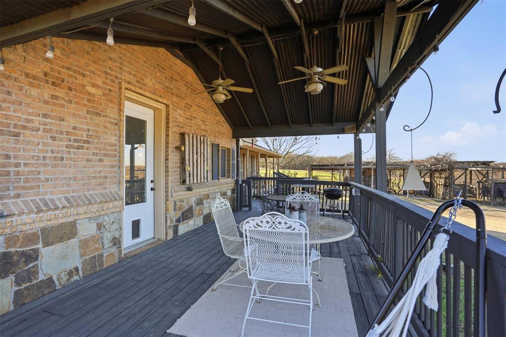5824 Sky Road Joshua, TX 76058 - Photo 33 of 40 a view of a patio with table and chairs