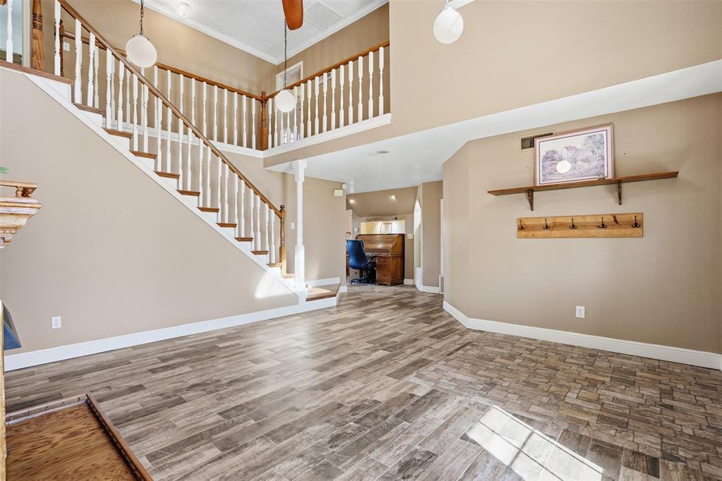5824 Sky Road Joshua, TX 76058 - Photo 10 of 40 a view of an entryway wooden floor and staircase