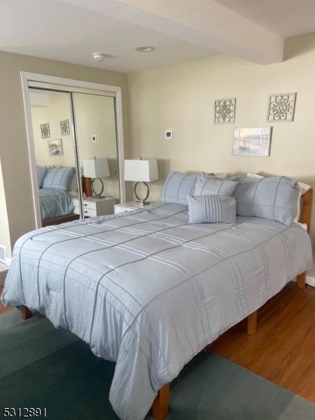 1409 River Road Belmar, NJ 07719 - Photo 19 of 22 a bedroom with a bed and window