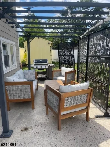 a view of a couches with wooden floor